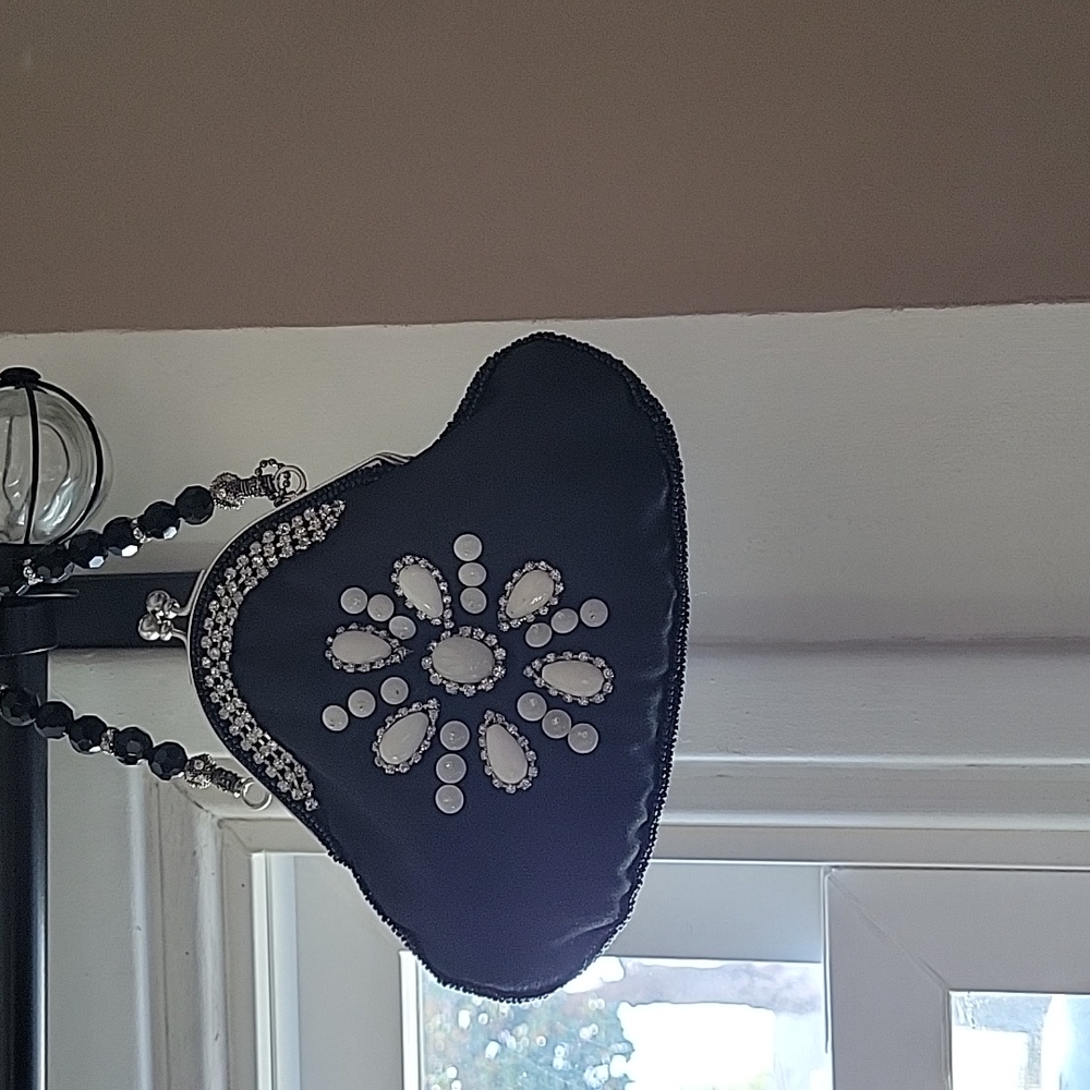 Small black clutch with beautiful stones with a beaded strap. Fully lined